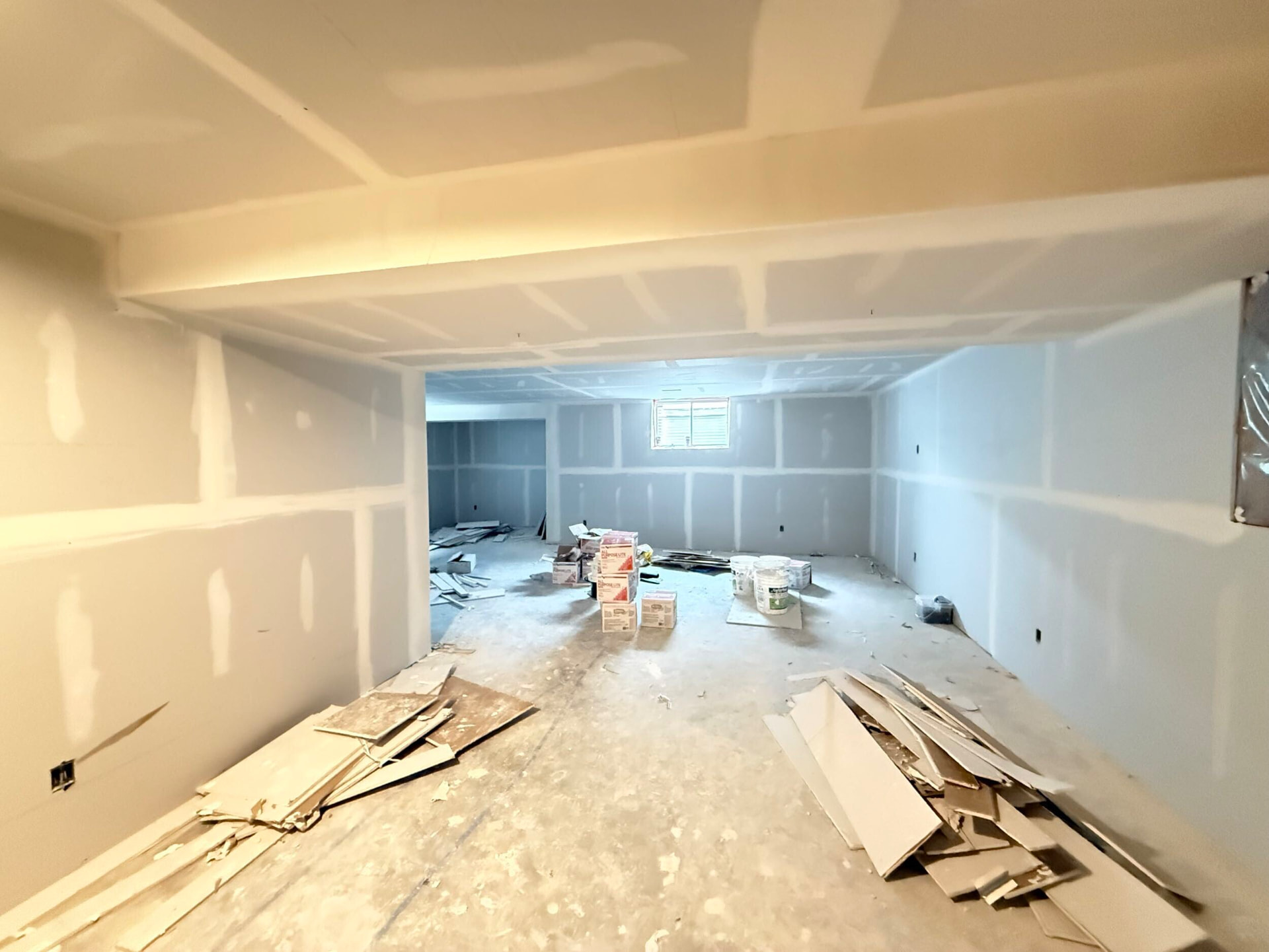 Basement after framing and drywall, taped and ready for finishing